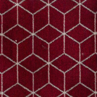 Geometric textile sample, red and white woven fabric, repeating hexagon grid pattern; Moroso “Block” A8820 fabric.
